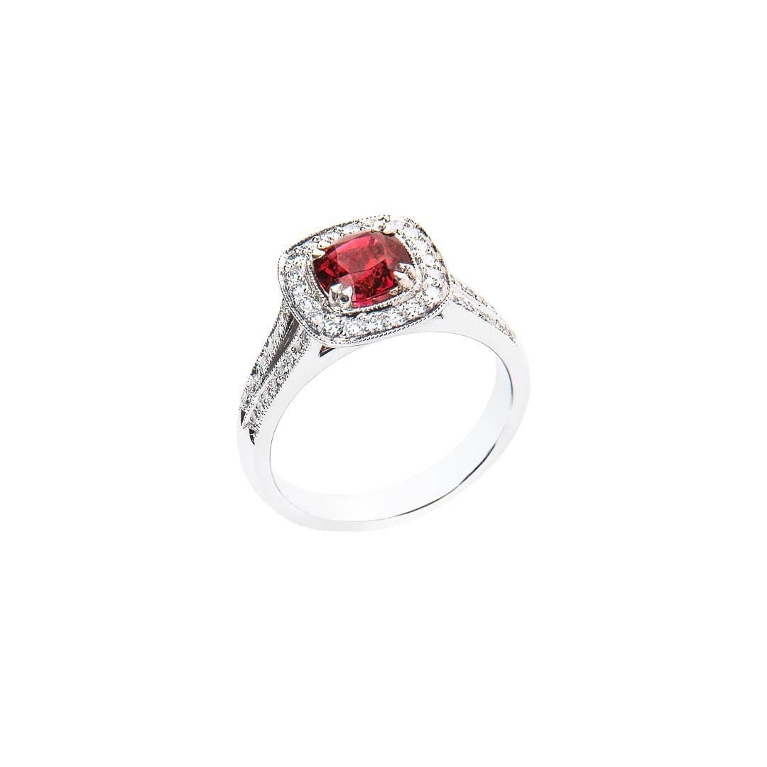 Cushion cut red spinel milgrain diamond halo ring handmade in white gold by Natalie Barney worn as an engagement ring.
